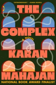 Book Cover with orange text that reads: The Complex by Karan Mahajan blue and orange gradient with arches in background