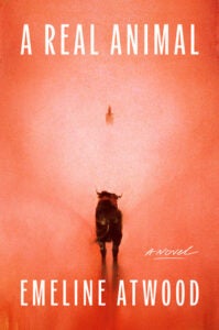 orange book cover with dog walking toward lighter background with small figure in distance. white text says "A Real Animal" Emeline Atwood